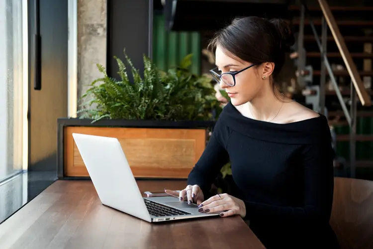 focused woman working on laptop